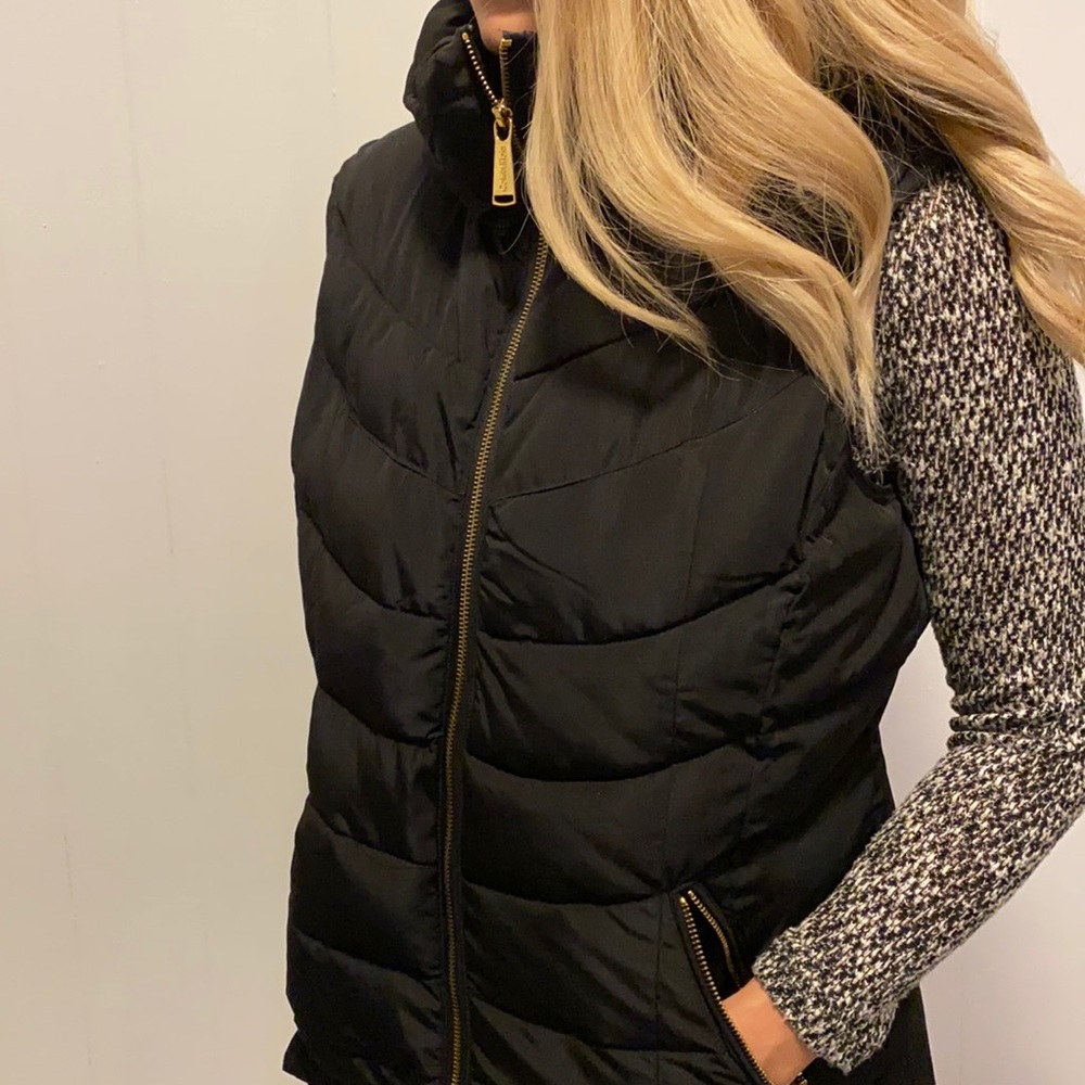 Black Calvin Klein vest with gold zipper. Size Medium.